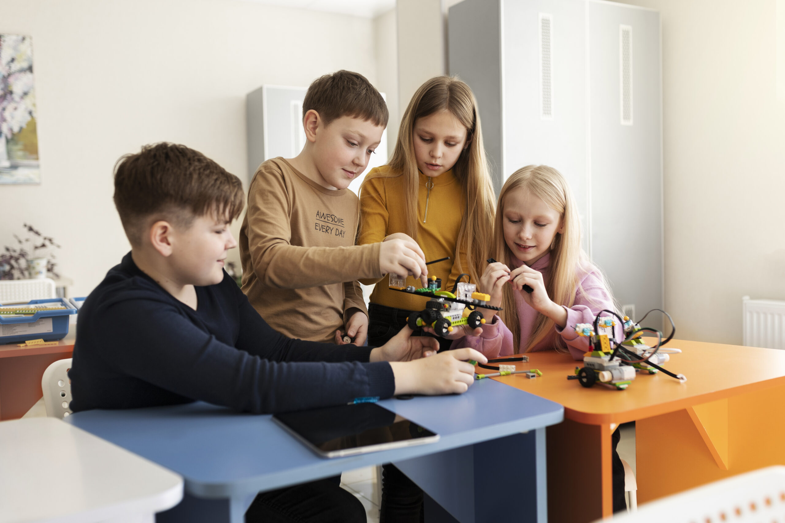 four-kids-building-drone-using-electronic-parts